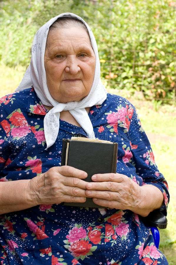 The Old Woman With The Bible Stock Photo